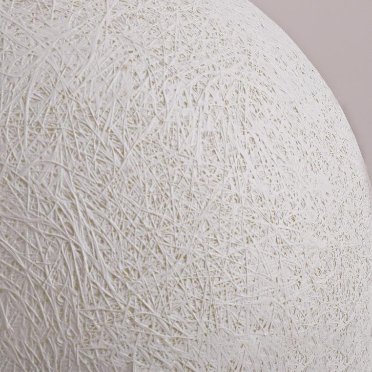 Close-up of the white fiber weave on the resin moon sphere