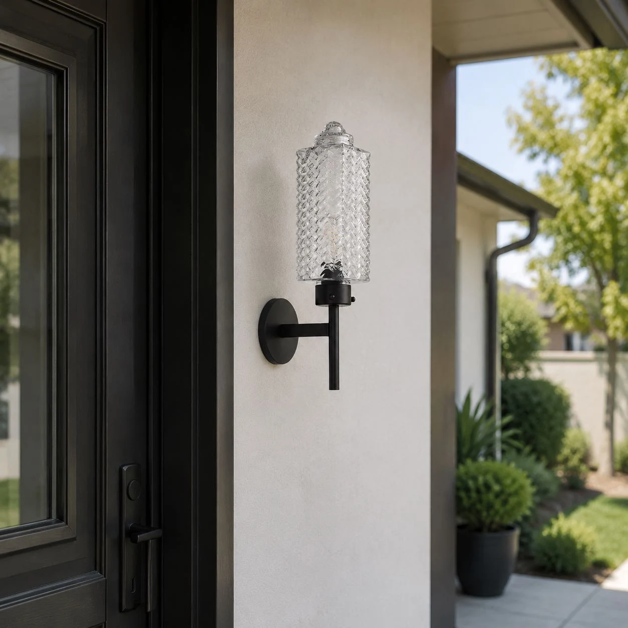 Rippled glass wall sconce on an exterior wall