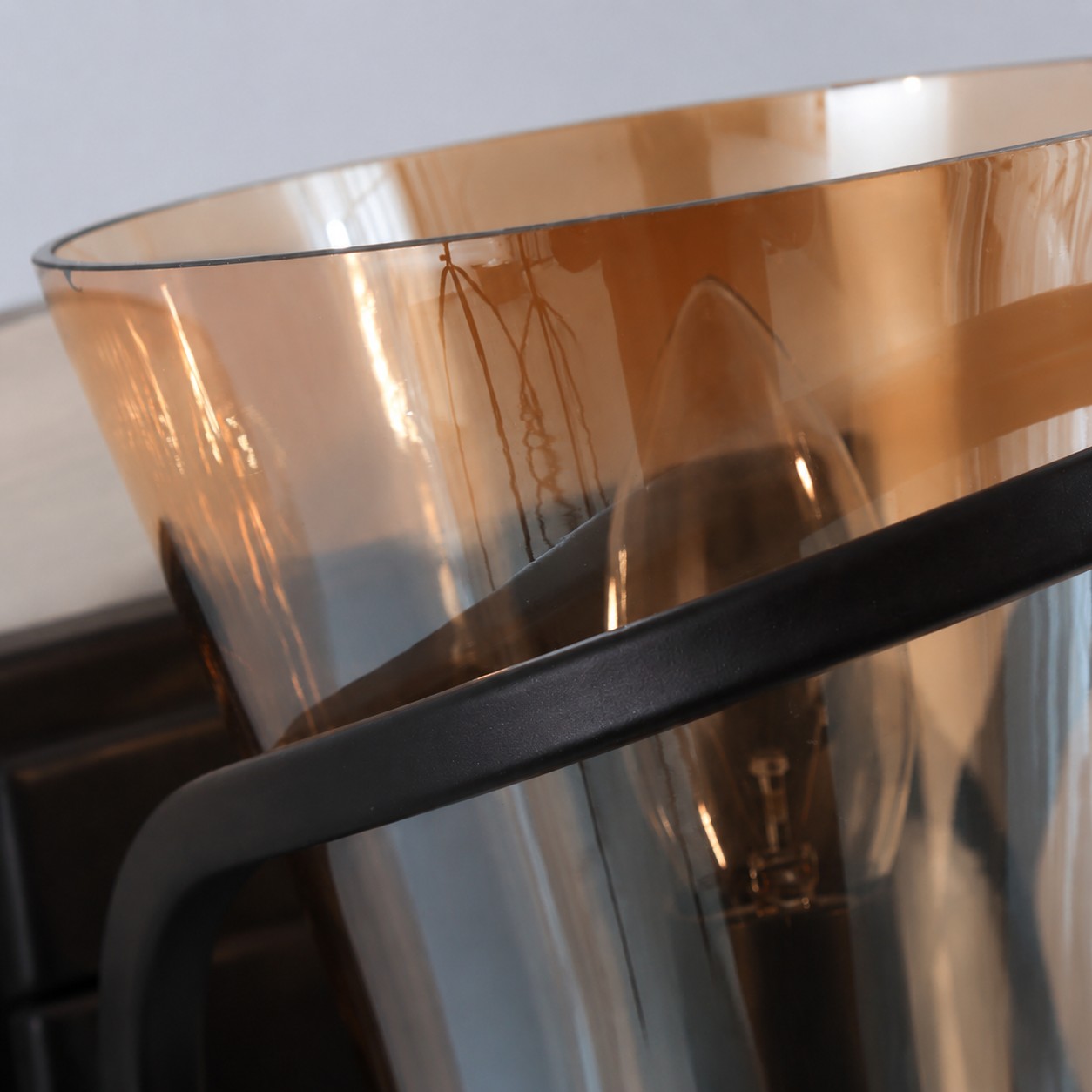 Amber glass shade and curved black support detail