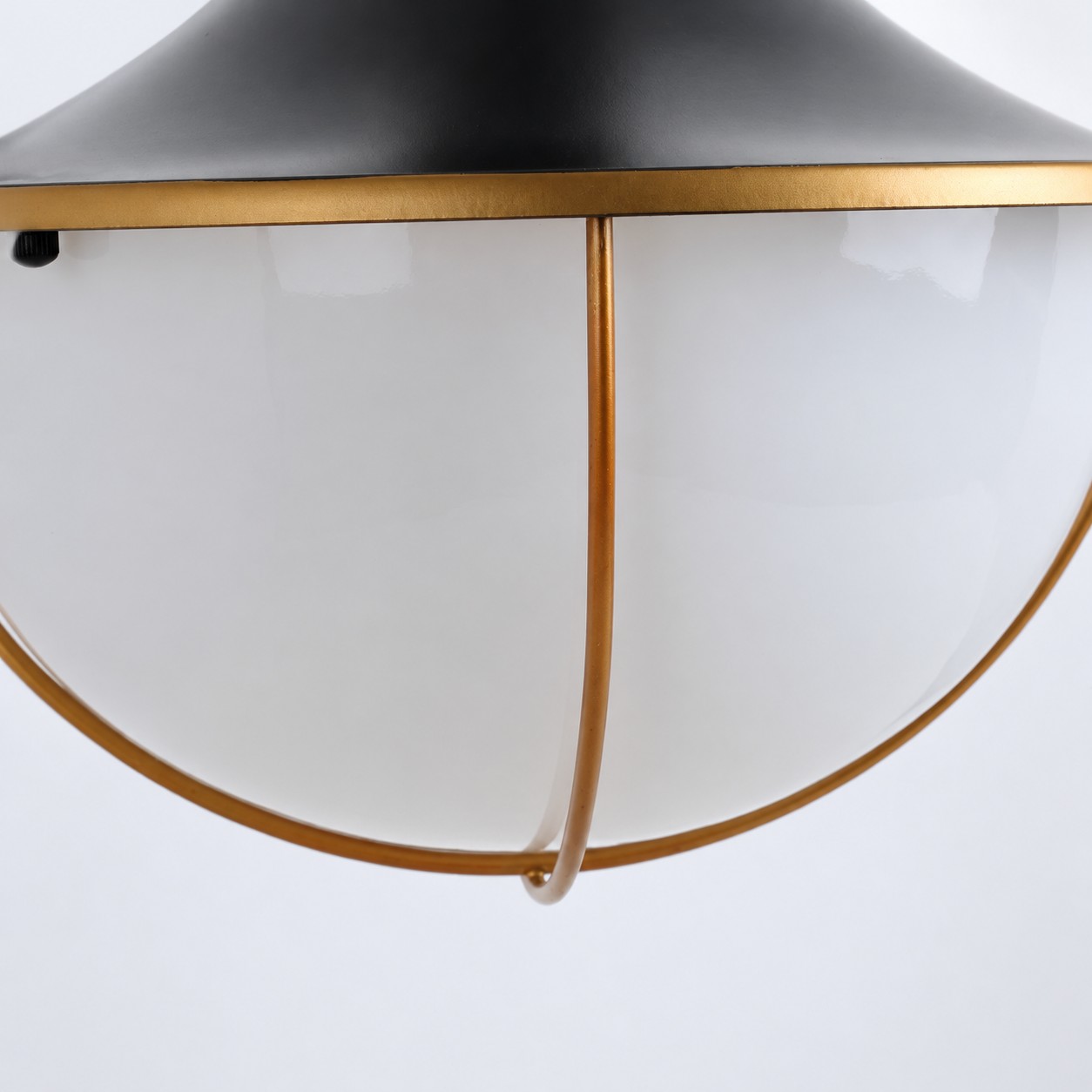 White glass globe and gold rim detail