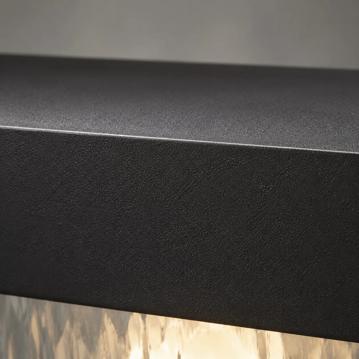 Close-up of matte black aluminum surface finish