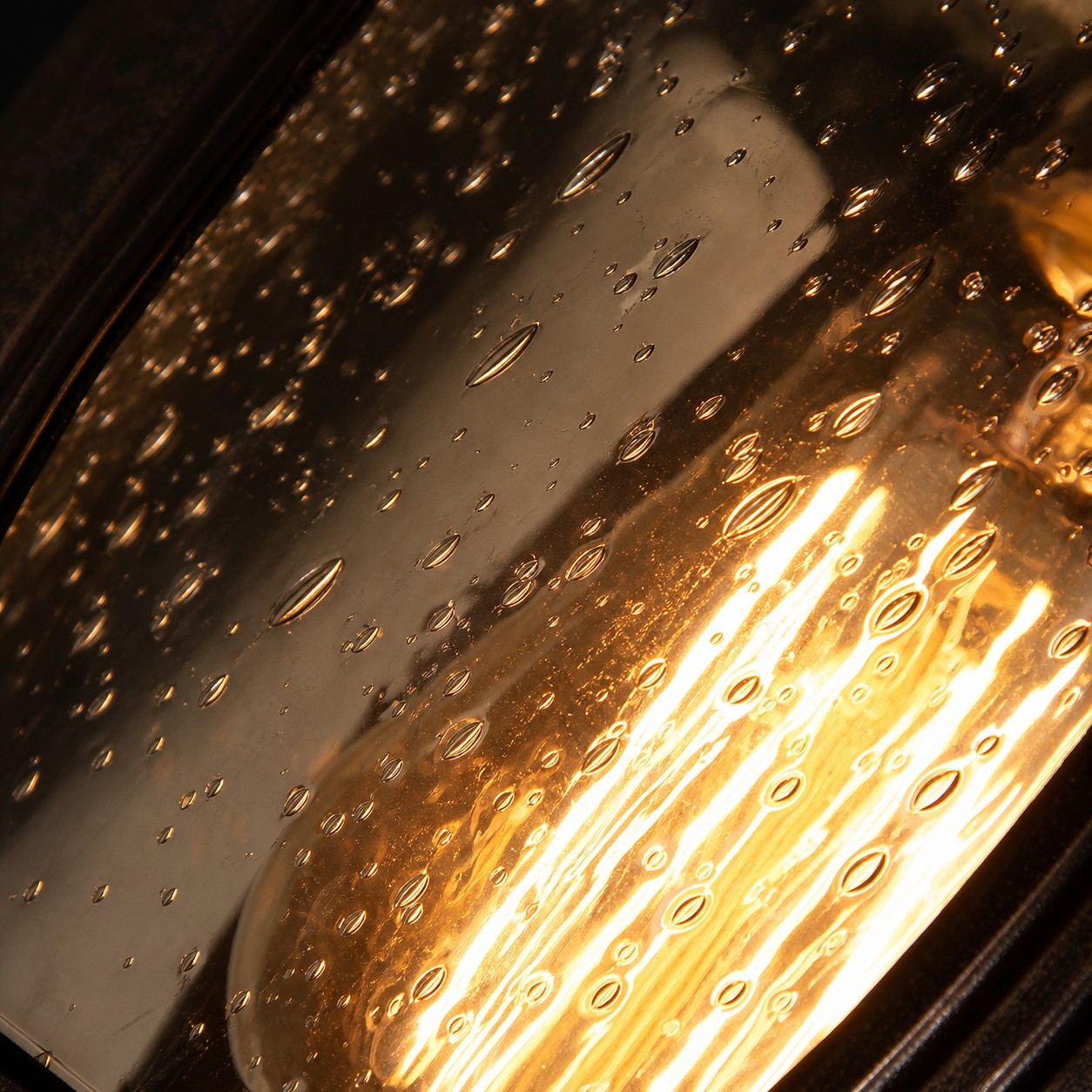 Close view of rain glass texture and warm light