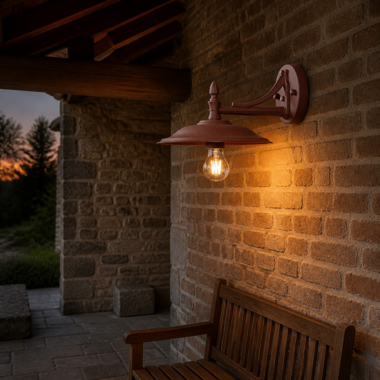 Coffee Brown Leviaxa wall sconce on a covered brick patio at dusk