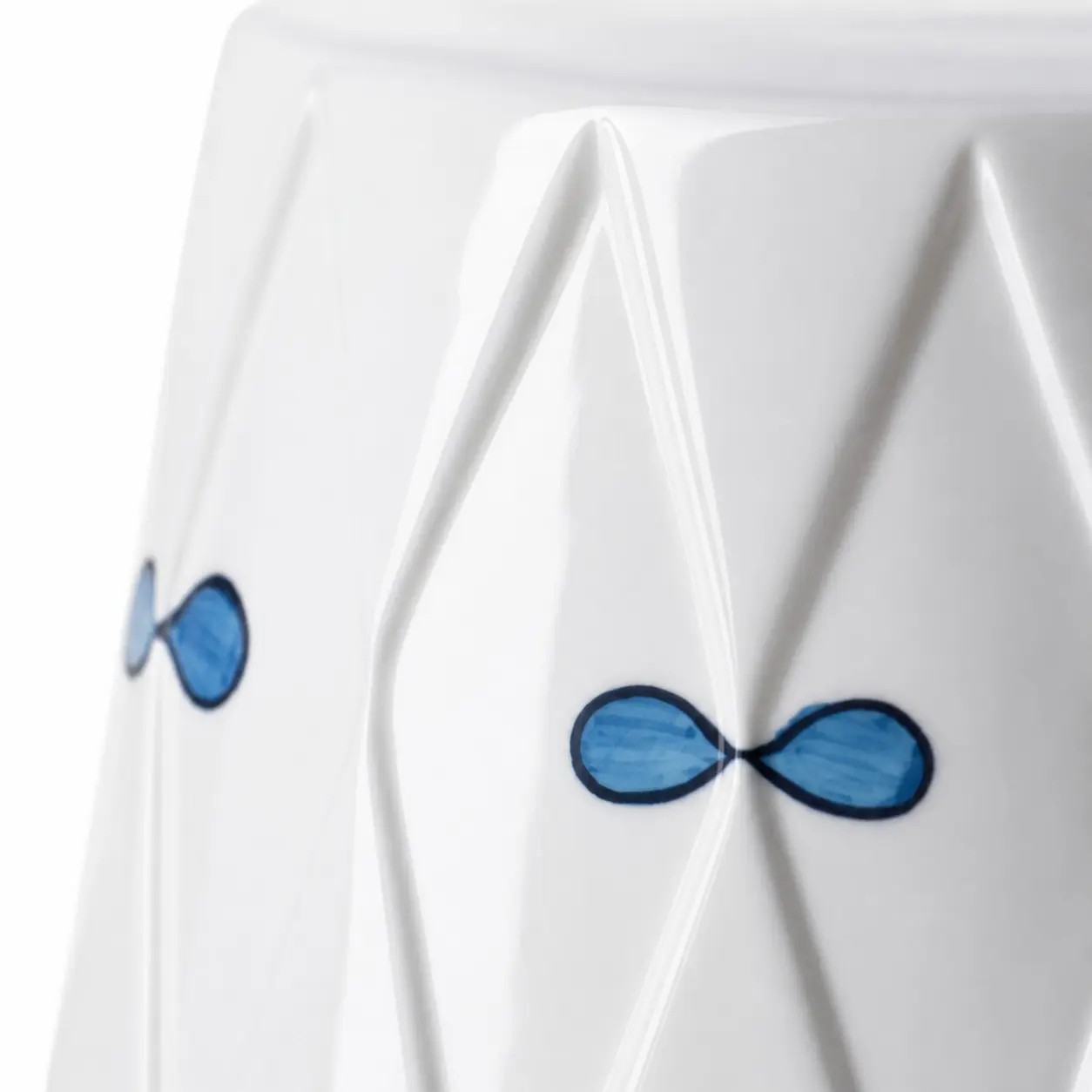 Close view of blue bow motifs and ceramic relief