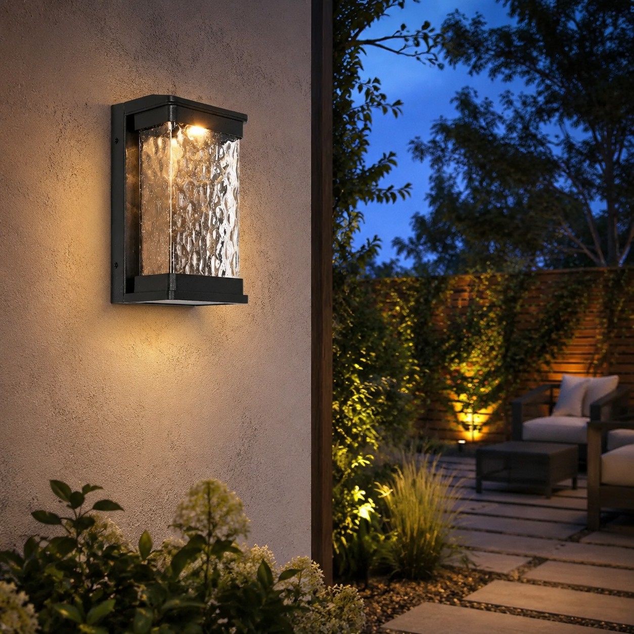 Outdoor LED wall light on a garden wall pathway