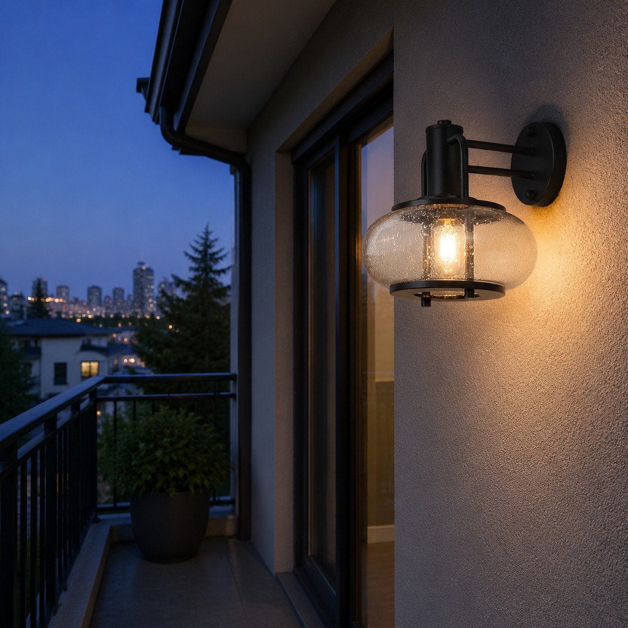 Black bubble glass wall sconce on a sheltered balcony wall