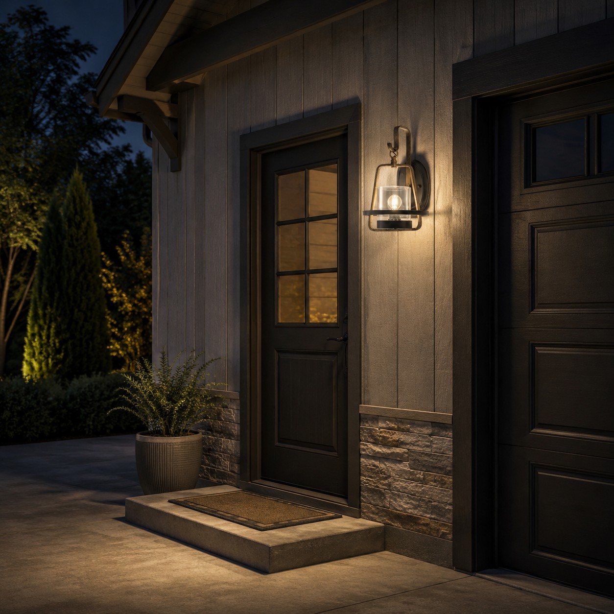 Rust finish clear glass wall sconce at a residential side entry