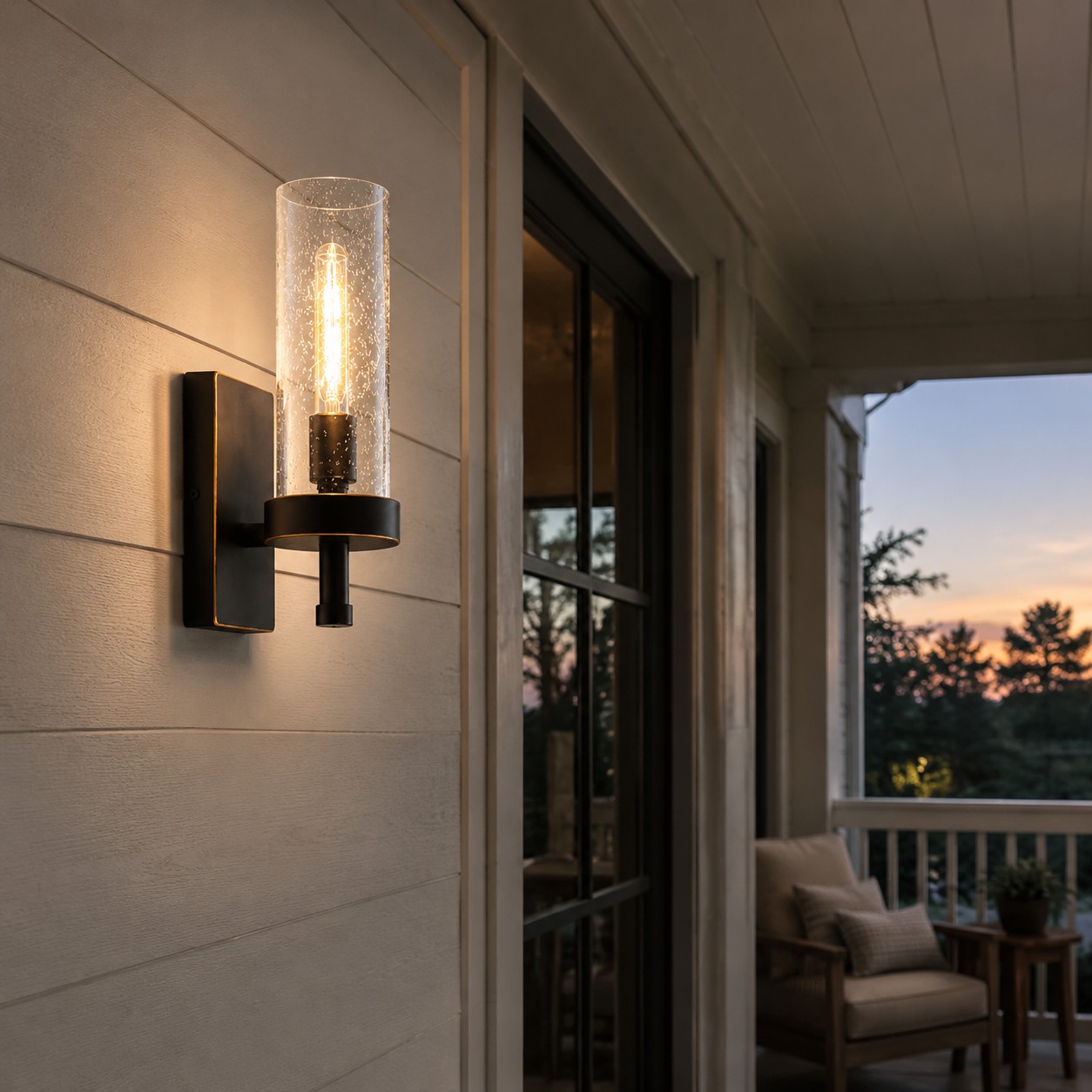 Wall sconce on a covered porch at dusk