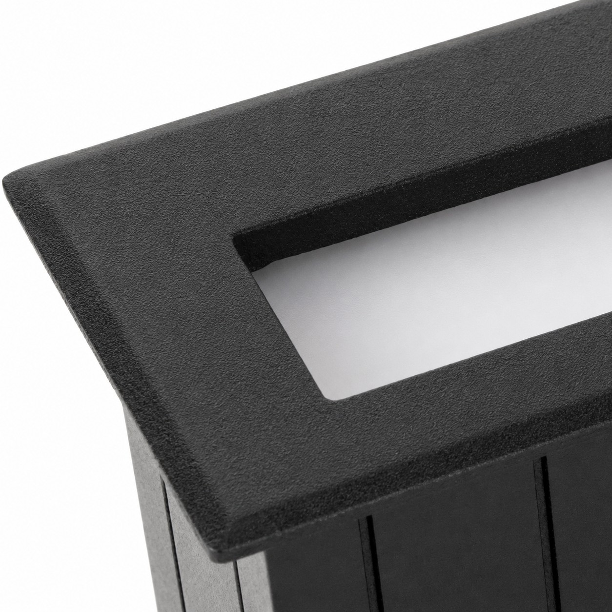 Corner close-up of powder-coated black frame and recessed frosted diffuser panel