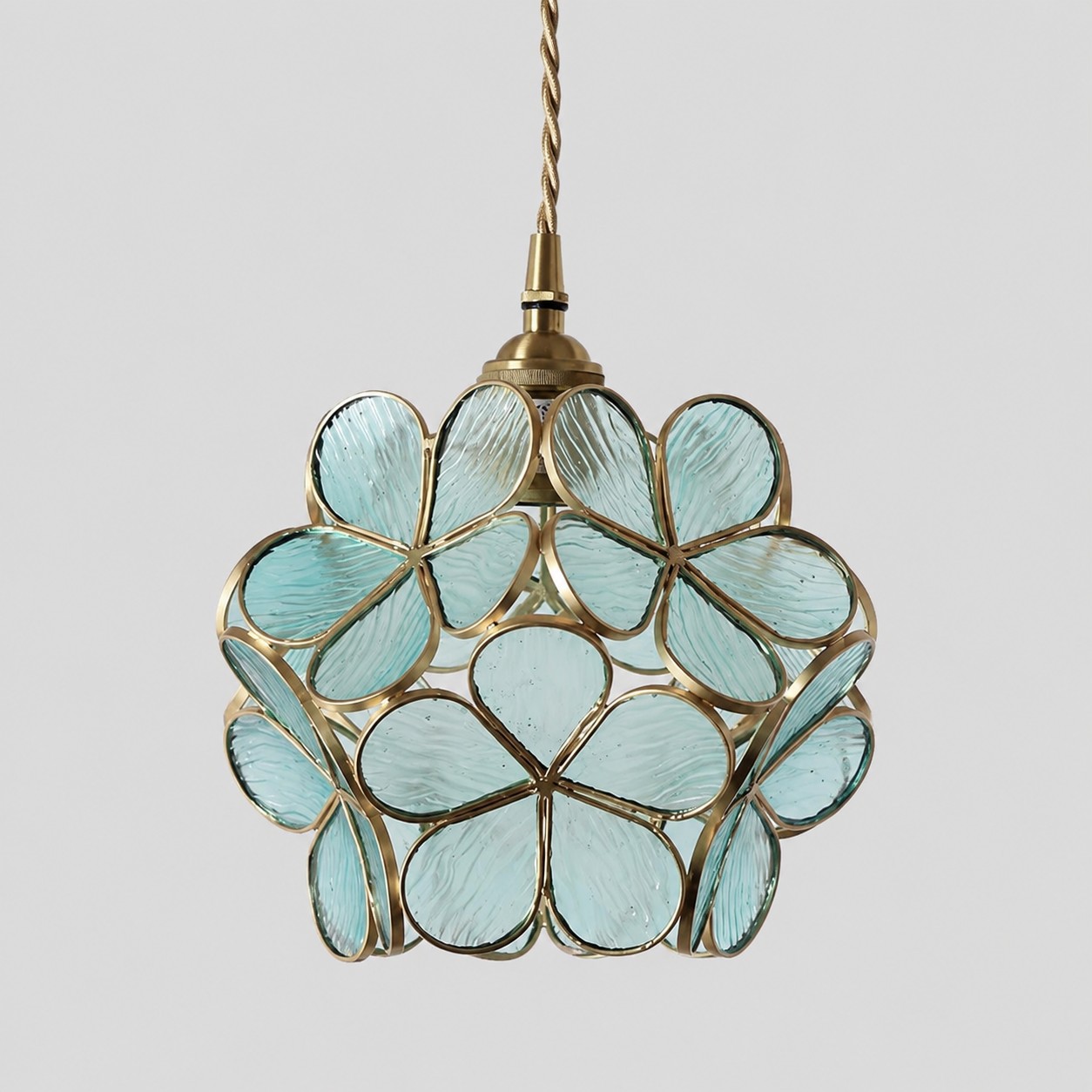 Blue flower-glass pendant on a white background