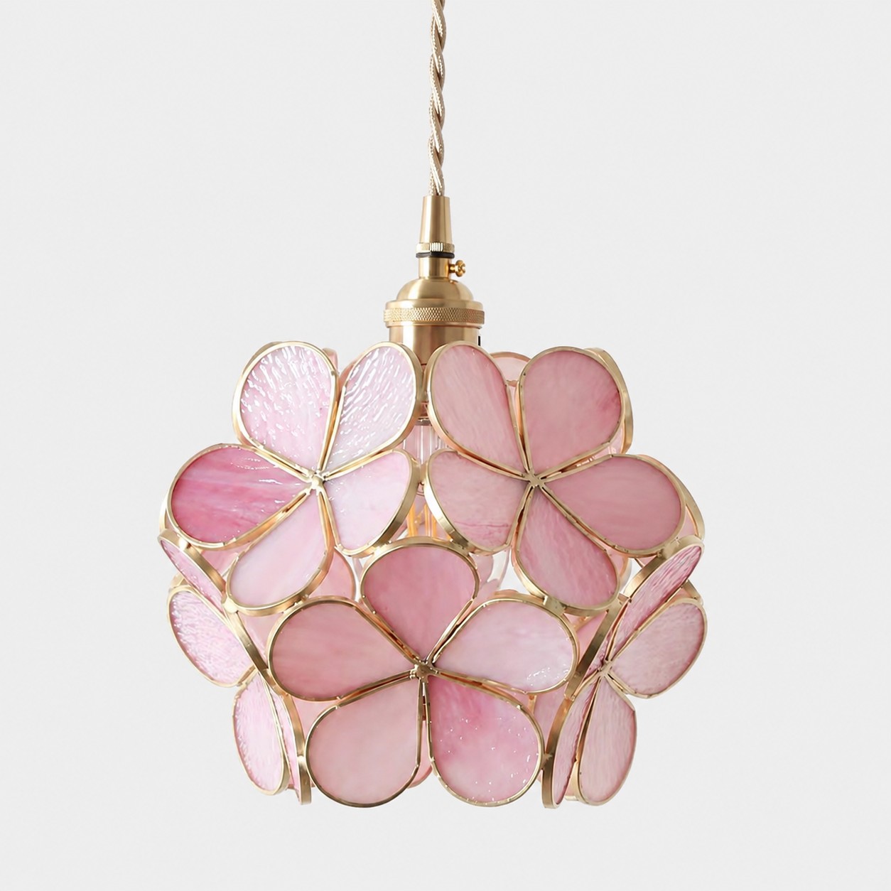 Pink flower-glass pendant on a white background