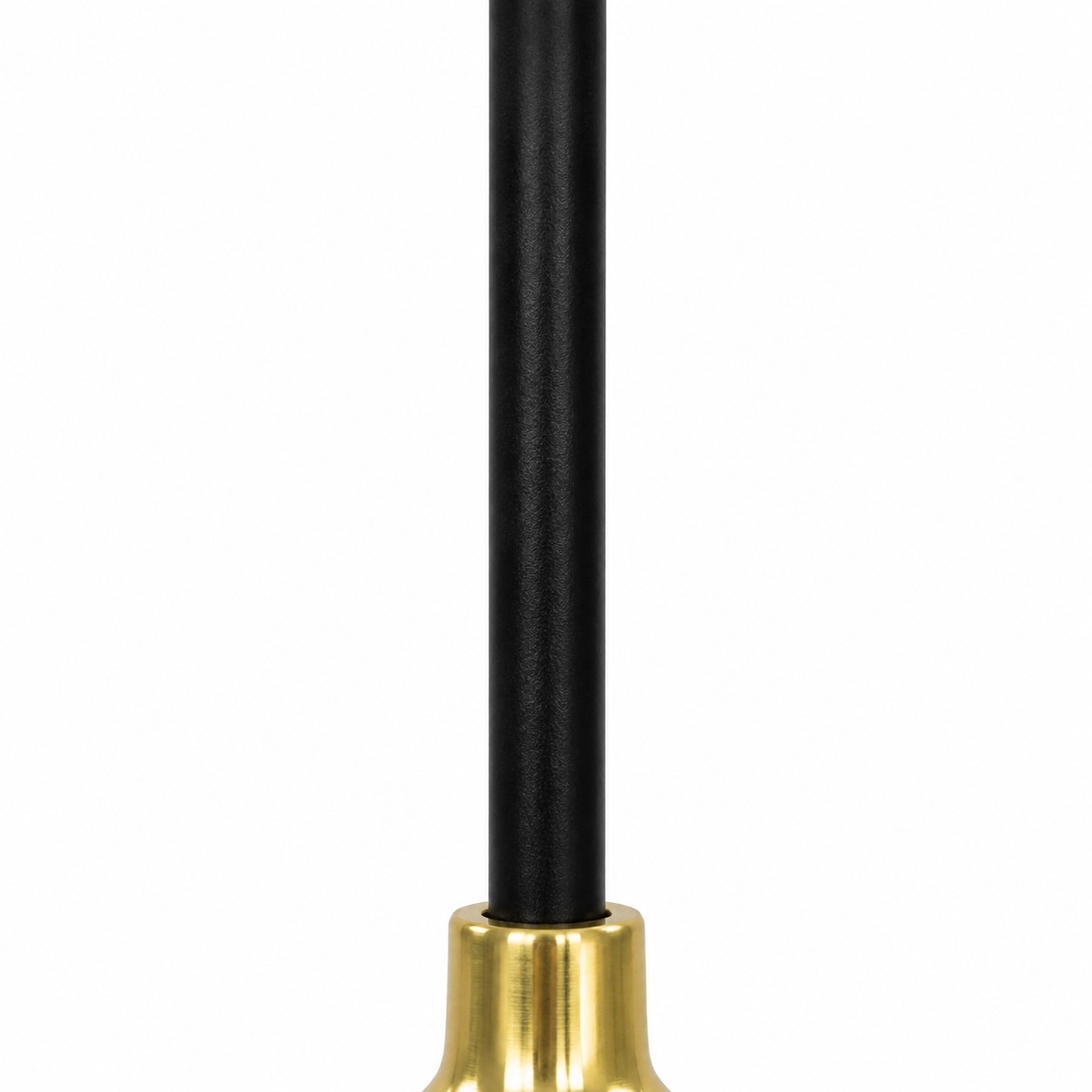 Close-up of the matte black cord entering the brass-toned metal socket
