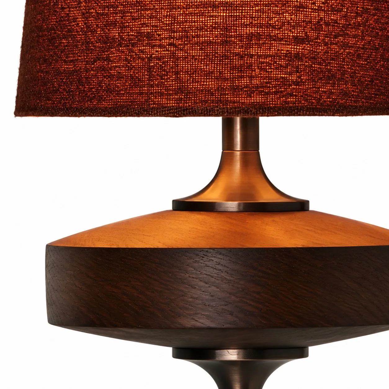Woven fabric shade with walnut and brass close-up