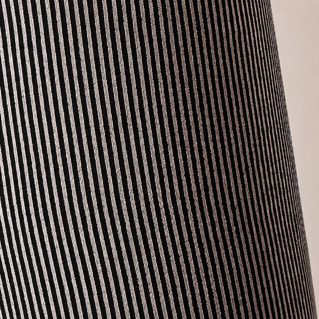 Macro close-up of gray striped woven fabric texture on the floor lamp
