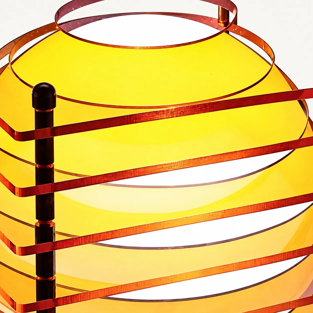 Glowing sphere seen through orange acrylic sheets